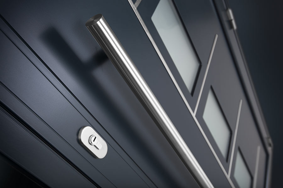 Grey aluminium entrance door with chrome bar handles