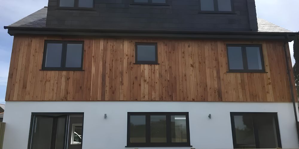 Why Choose uPVC Windows and Doors - large modern house with black uPVC Windows - Landmark Windows and Doors